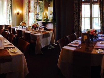 Dining Room tables set with tablecloths for a wedding dinner